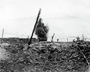 Bursting: British shell bursting on German trenches, WW1