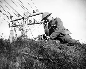 Wires: British soldier checking telephone lines, WW1