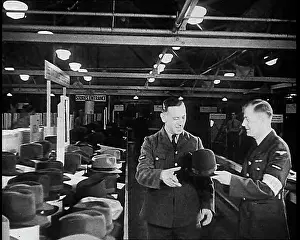 Choosing: British Soldier Choosing A Hat For His Journey Home