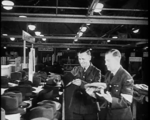 Choosing: British Soldier Choosing A Hat For His Journey Home