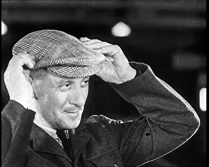 Choosing: British Soldier Choosing A Hat For His Journey Home