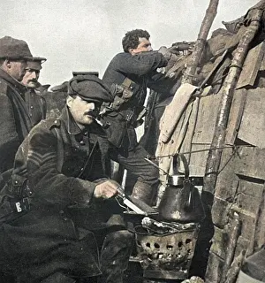 Braziers: British soldier cooks dinner on a brazier in trench