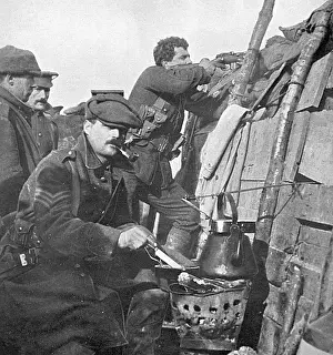 Mealtime: British soldier cooks dinner on a brazier in trench
