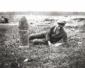 Bombshell: British soldier writing home next to bombshell, WW1