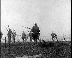 Fences: British Soldiers Climbing Over and Under Barbed