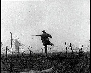 Fences: British Soldiers Climbing Over and Under Barbed