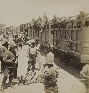 30 40 People: British soldiers and horses boarding a train to