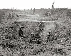 Sheltering: British soldiers sheltering in shell hole, Western Front, WW