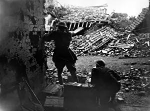 Collapsed: Two British soldiers shooting from behind a wall, WW1