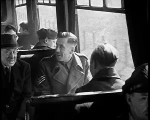 Happily: British Soldiers Talking Happily on a Train