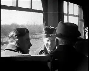 Happily: British Soldiers Talking Happily on a Train
