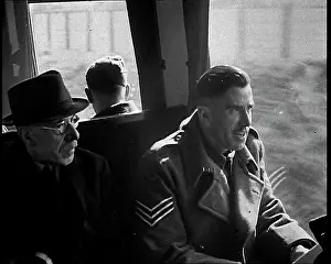 Happily: British Soldiers Talking Happily on a Train