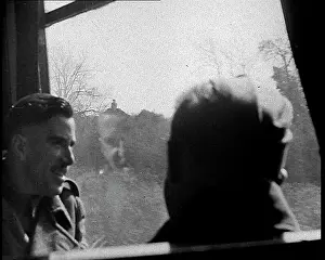 Happily: British Soldiers Talking Happily on a Train