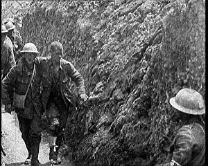 Assisted: British Soldiers Walking Through A Trench