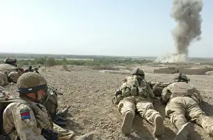 Improvised: British soldiers watching the after effects of a 500lb bomb