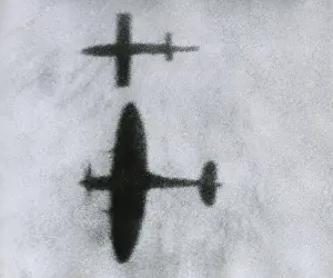 Drones: British Spitfire flies beside a V-1, attempting