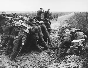 Extricating: British troops extricating water cart from shell hole, WW1