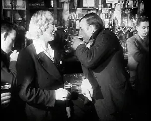 Barman: A British Woman and a British Man Standing