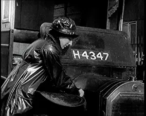 Waterproof: British Woman Working on the Engine Of Her