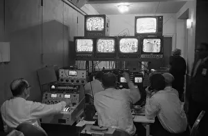 Lcgr1507: Broadcasting technicians, seated in front of bank