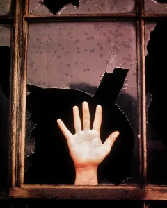 Dire: Broken Glass Window Abandoned Building Hand Waving