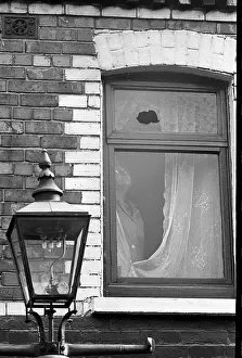 Deprivation: Broken window, Falls Road, Belfast, Northern Ireland