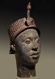 Countenance: Bronze head with beaded crown and plume. 12th-14th