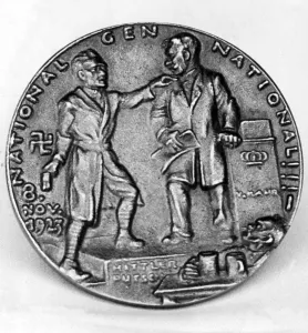 Mugs: Front of a bronze medal for the failed Beer