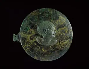 Applique: Bronze mirror case, in two parts. Top, outer face: applique