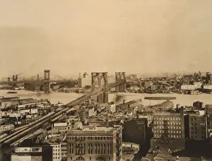 Transporation: Brooklyn and Manhattan Bridges span the East