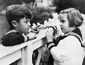 Friendliness: Brother and sister talking with each other