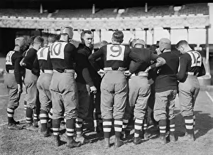 Huddle: Brown University football team in a huddle