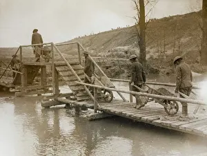 Wheelbarrows: Brtish troops crossing a river, Western Front, WW1