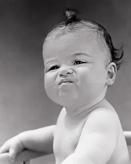 Odor: Brunette Baby Boy with Serious Pouting Superior