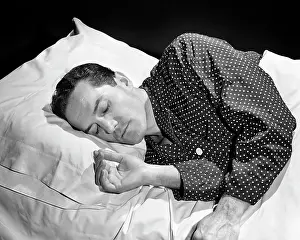 Consciousness: Brunette Man Peacefully Asleep on Right Side Head