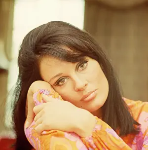 Sulky: Brunette model in thoughtful pose