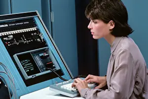 Networking: Brunette Woman Monitoring a Network Controller