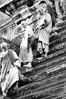 Precarious: Buddhist priests on steep stairs, Angkor Wat, Cambodia