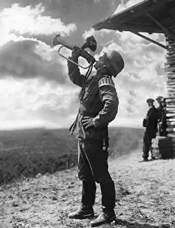 Trumpeter: Bugler blows a signal during a maneuver, 1938
