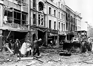Bulldozer: A bulldozer clears away debris in a devestated ?