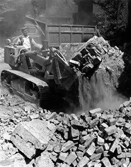 Bulldozers: BULLDOZING A BUILDING