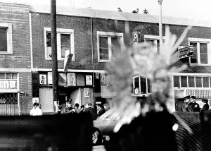Storefront: A bullet hole in a storefront window was ?