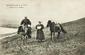 Buryats: Two Buryats with their horses, Siberia