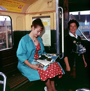 Happily: BUS CONDUCTRESS