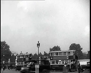 Roundabout: Bus Travelling at the Roundabout In Front Of