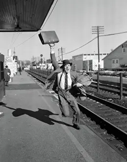 Topcoat: Businessman with briefcase in air running after