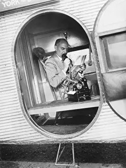 Businessmen: Businessman with Dictaphone on an airplane