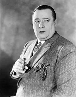 Pinstripes: Businessman holding cigar