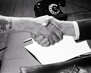 Tatoo: Businessman Shaking Hands with Workman Manual