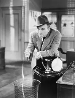 Fedora: Businessman with ticker tape machine